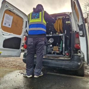 Drainage & Plumbing LTD engineer from professional drainage company using high-pressure jetting to clear a blocked drain