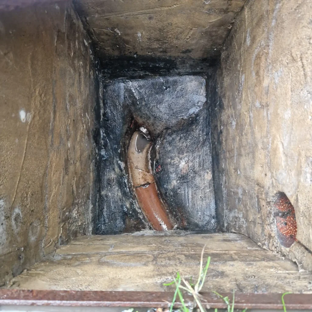 Drainage & Plumbing LTD engineer using high-pressure jetting to clear a blocked drain