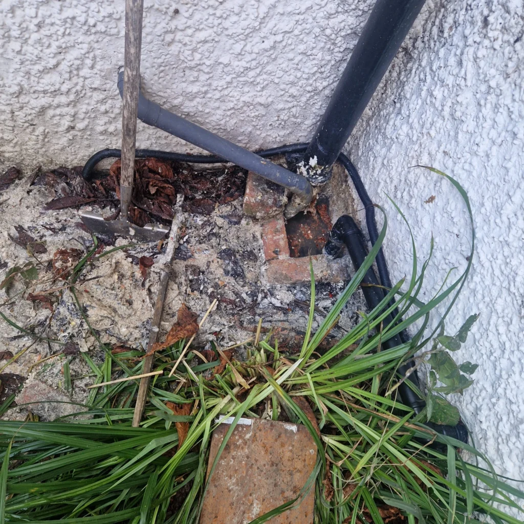 High pressure drain jetting clearing a blocked drain