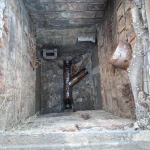 Drainage & Plumbing LTD engineer standing next to a service van in Purley, ready for emergency drain unblocking.
