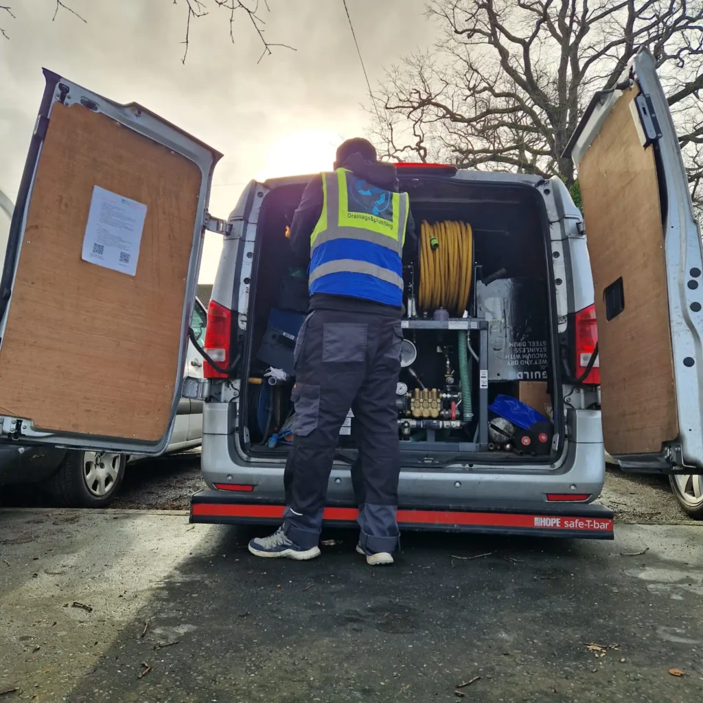 Professional drainage engineer unblocking a drain in Sutton and Wallington (SM6) with a high-pressure jetting van