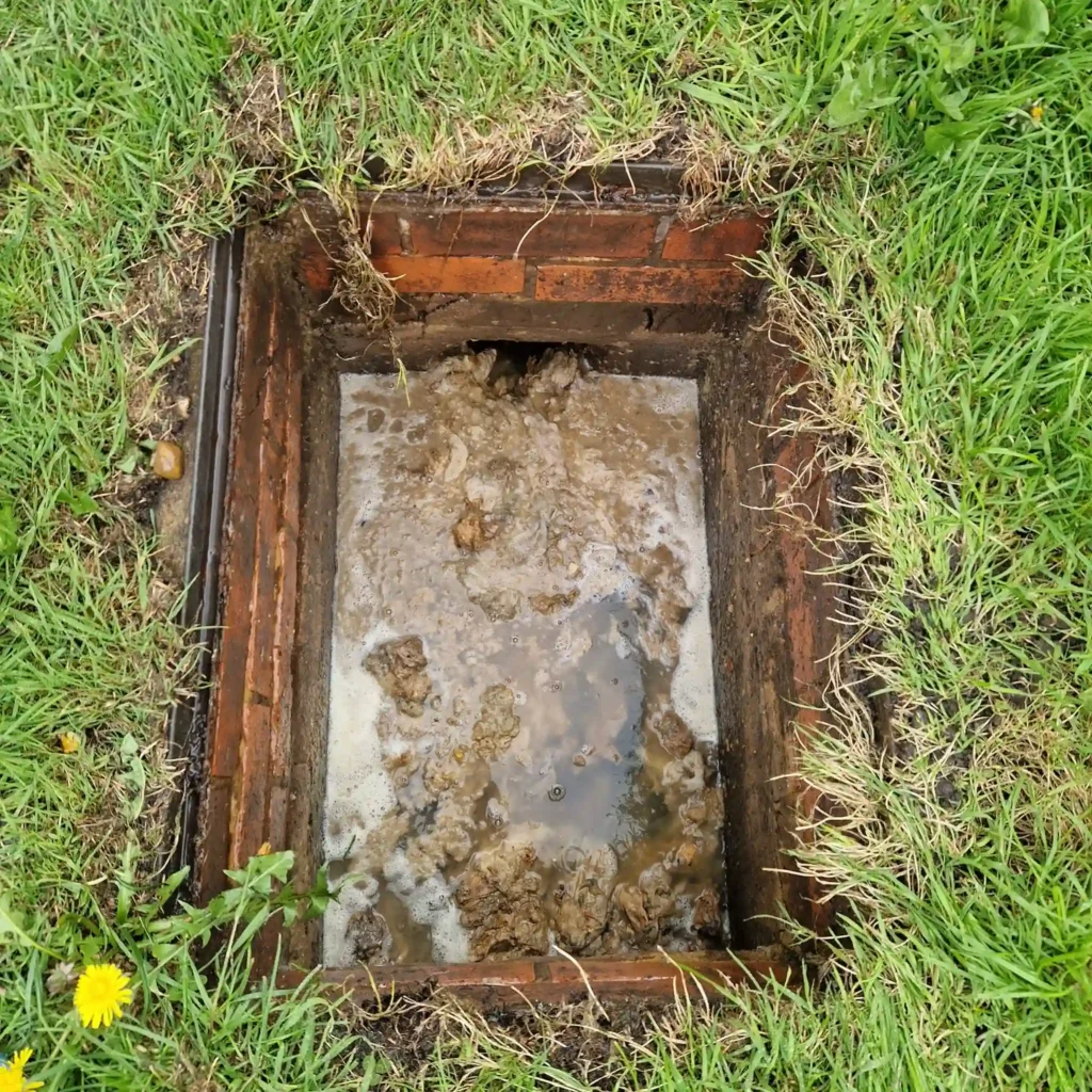 Professional high-pressure water jetting by Drainage & Plumbing LTD to clear stubborn blocked drains in Esher.