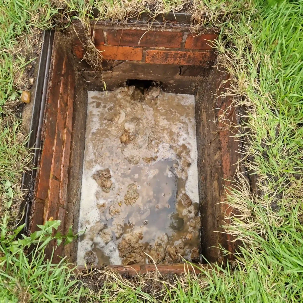 Drainage & Plumbing LTD resolving a blocked manhole for a client in Woldingham.