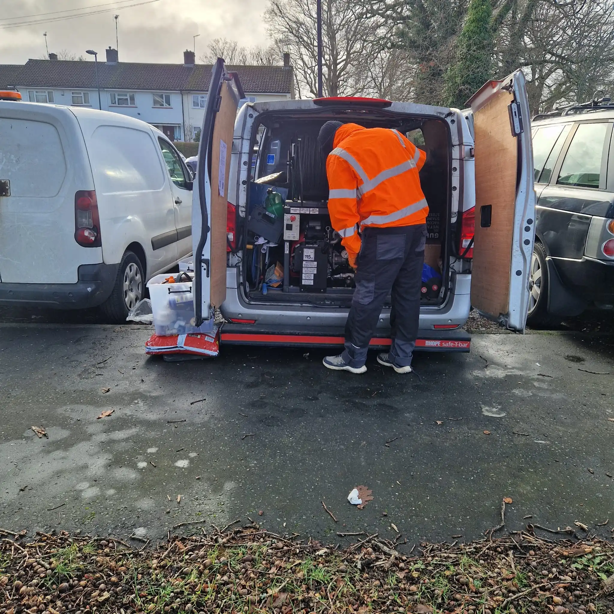 Ground Movement Drain Damage: 5 Signs & Fast Fixes 5 High-pressure water jetting equipment clearing a drain affected by ground movement damage in a South East England driveway