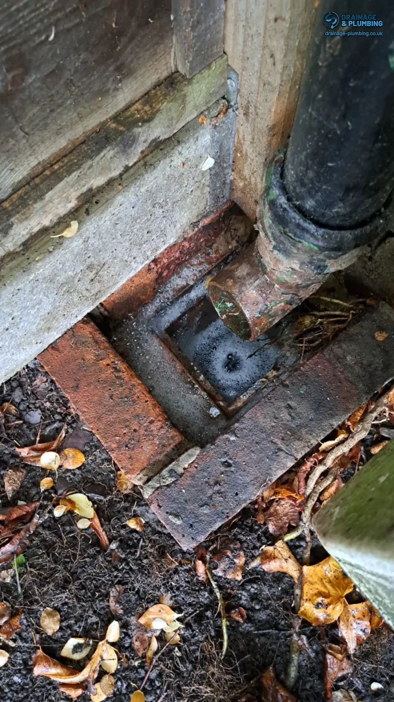 Croydon Homes: Reduce Drain Blockage Risk Fast 13 Drainage engineer using high-pressure jetting equipment to clear an older residential drain run