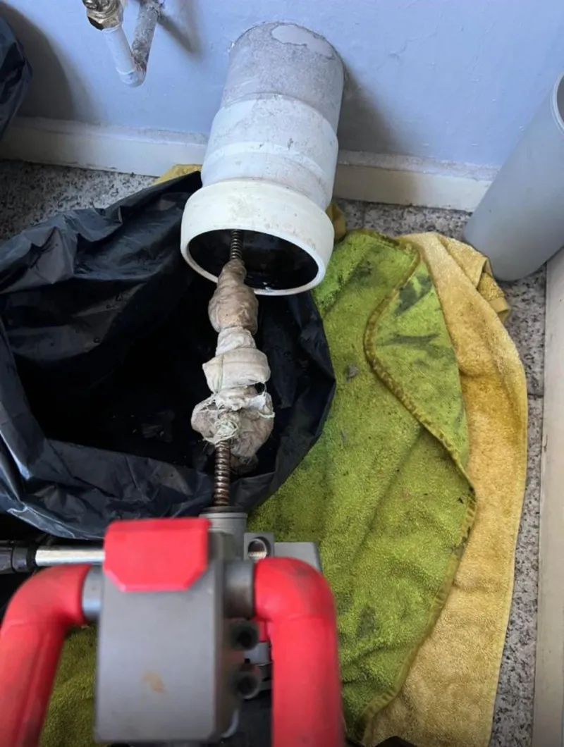 Rat gate drain installation showing internal flap valve preventing rodent backflow