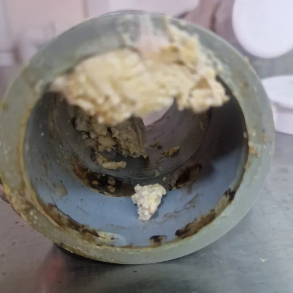 blocked pipe causing water backup before emergency pipe cleaning in South East England