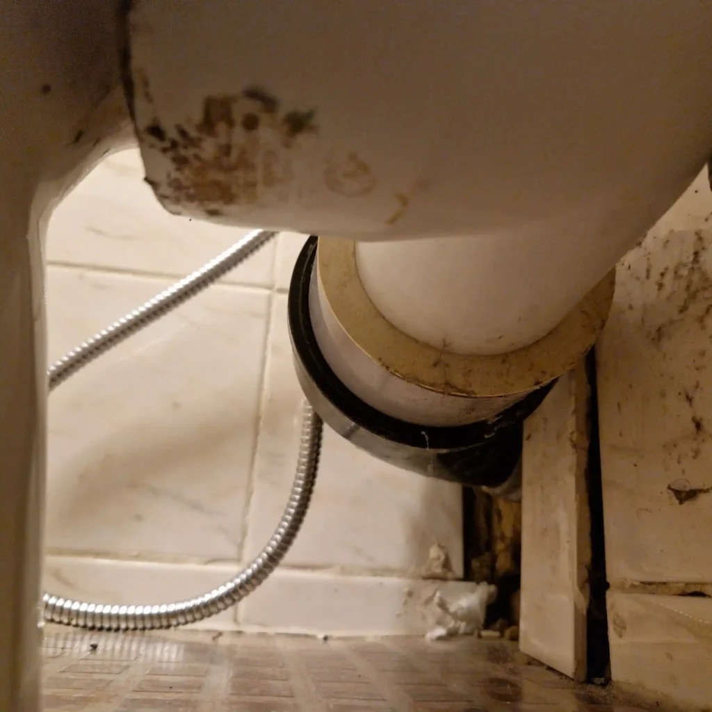 Emergency drain unblocking using high pressure jetting after toilet overflows at night
