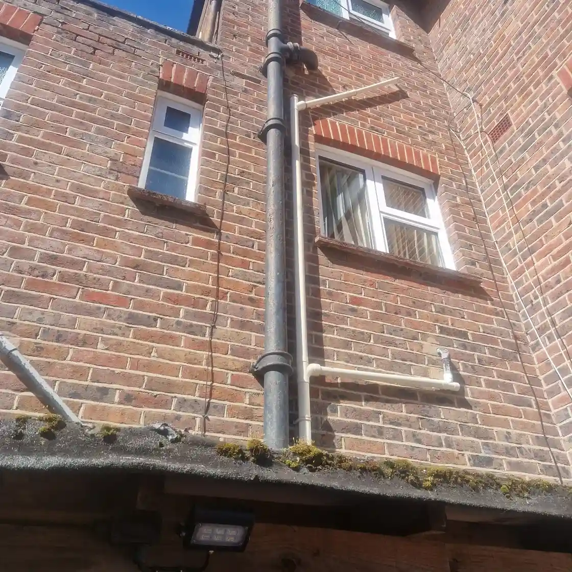 Inspection chamber being checked during a drain unblocking job