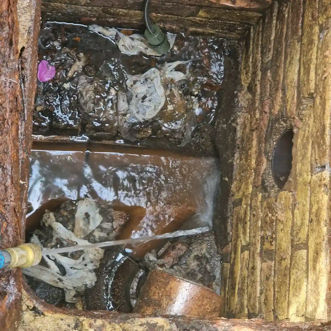 Drain repair specialist carrying out blockage removal in Horley
