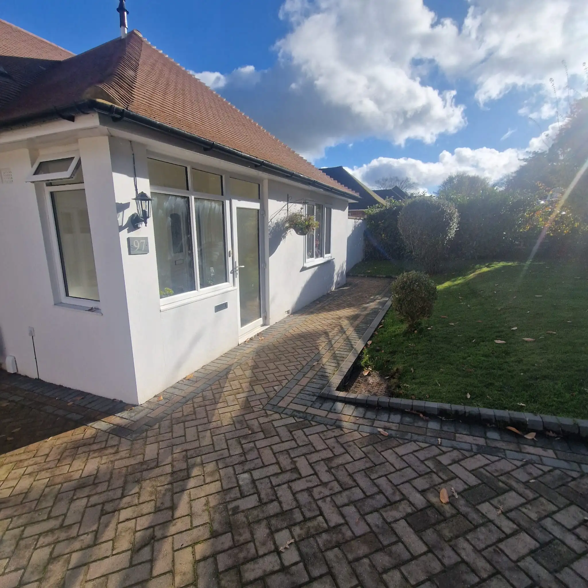 Blocked drain experts Surrey using high-pressure jetting equipment to clear a residential drain blockage