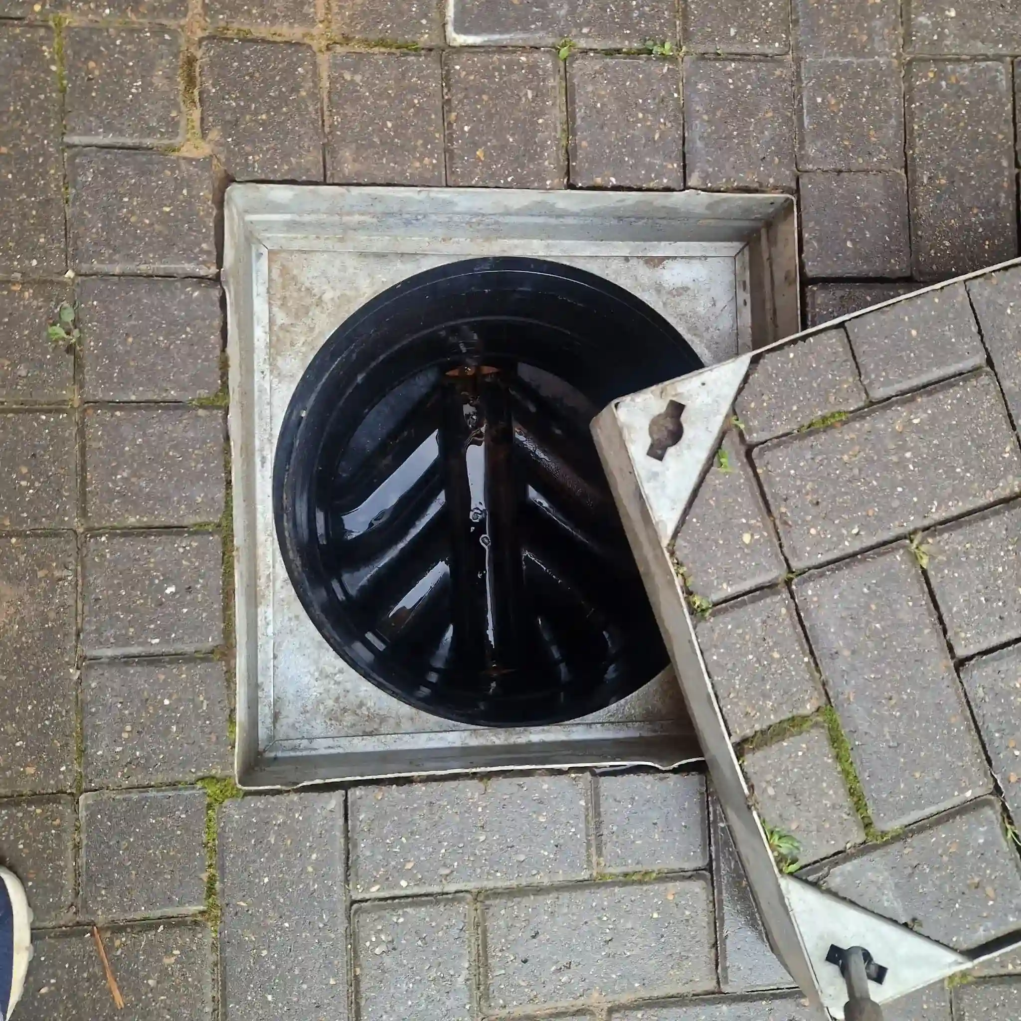 High-pressure drain jetting equipment used to clear tree root blockage in South London clay pipe system