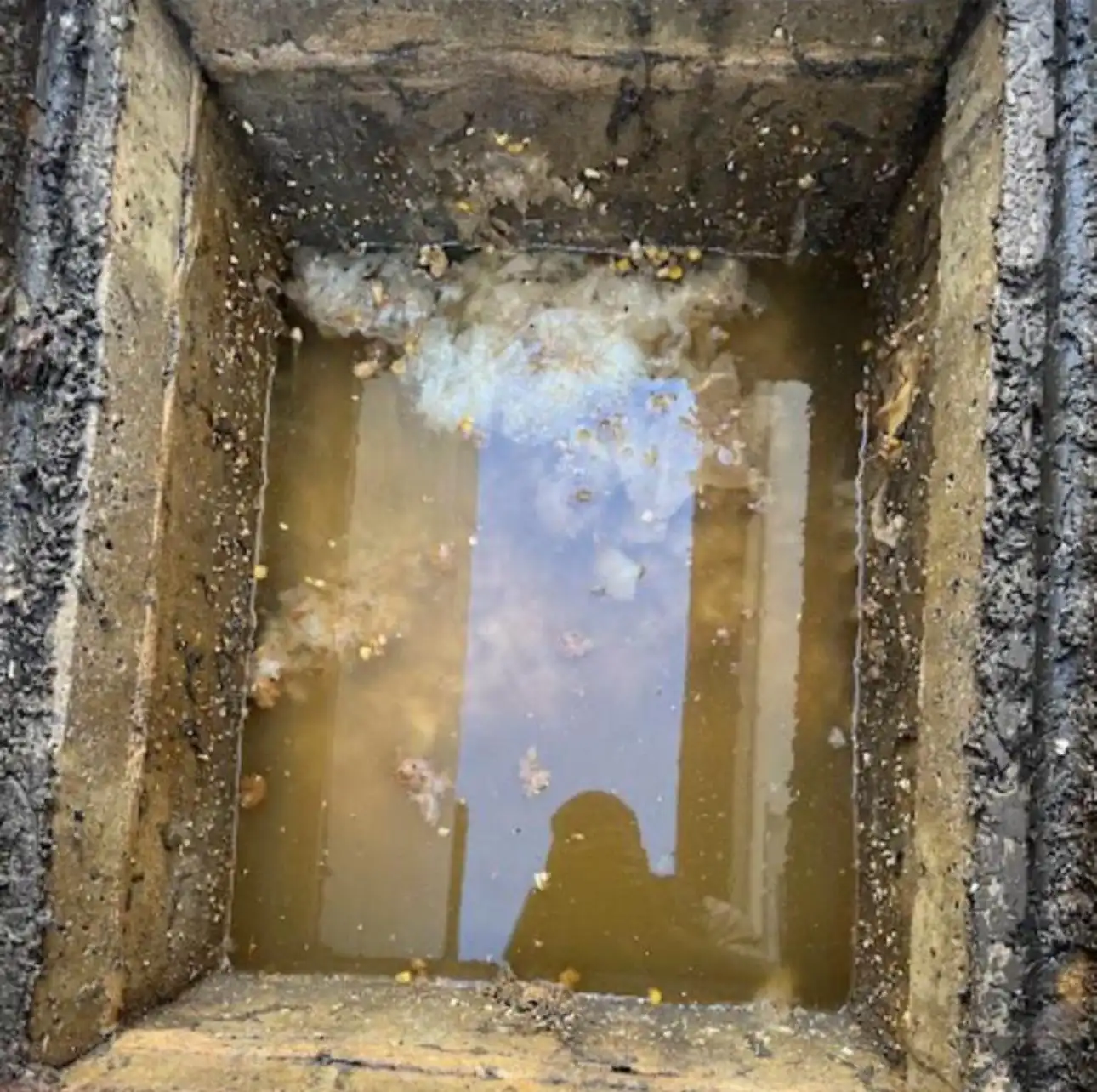 drainage engineer completing a drain repair in Wallington using specialist equipment on a residential property