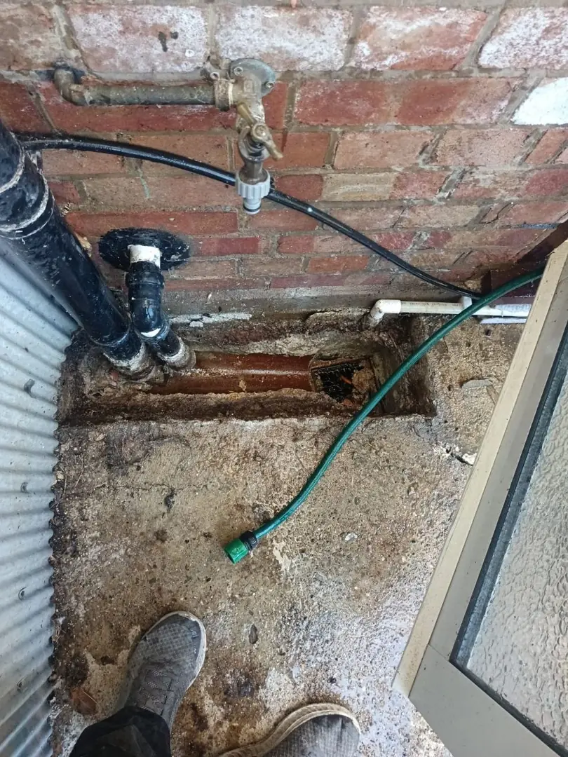Overflowing Drain Pipes: Don't Ignore the Warning Signs 9 blocked manhole chamber filling with wastewater, a sign of a wider overflowing drain pipes problem beyond a single fixture