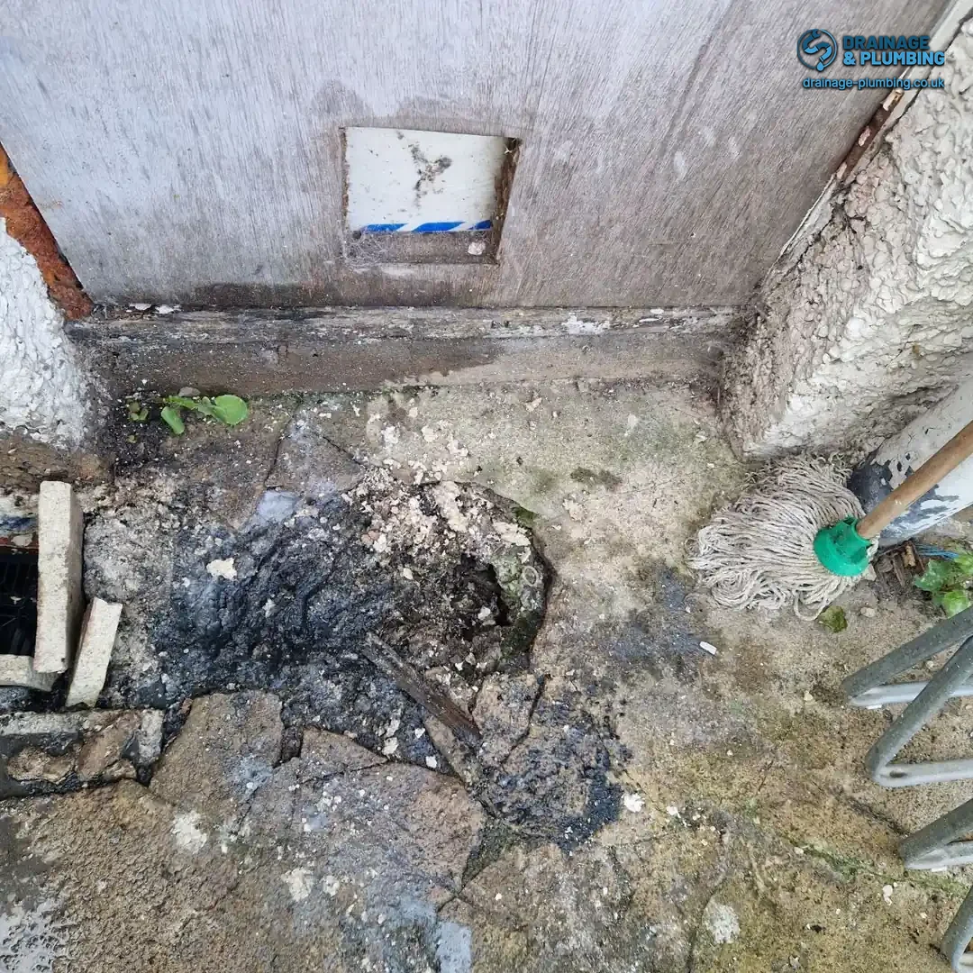 close-up of a blocked toilet drain caused by grease build-up made worse by summer heat pipe damage