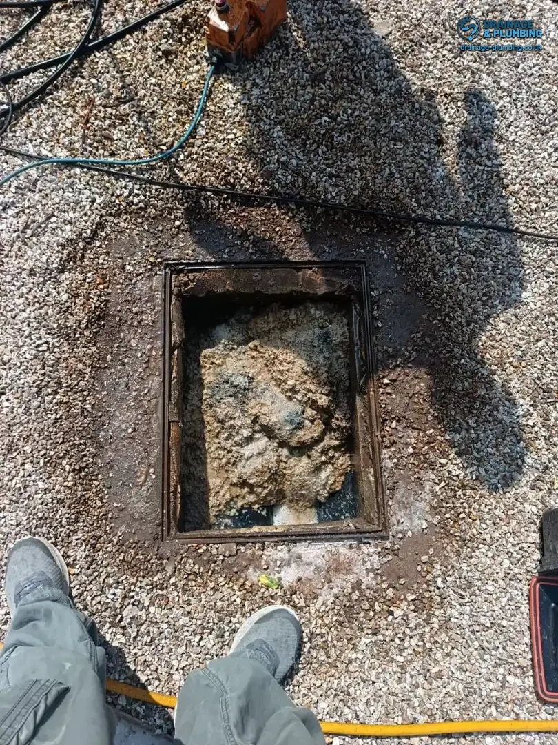emergency drainage response — high-pressure jetting clearing a blocked drain outside a South East England terrace