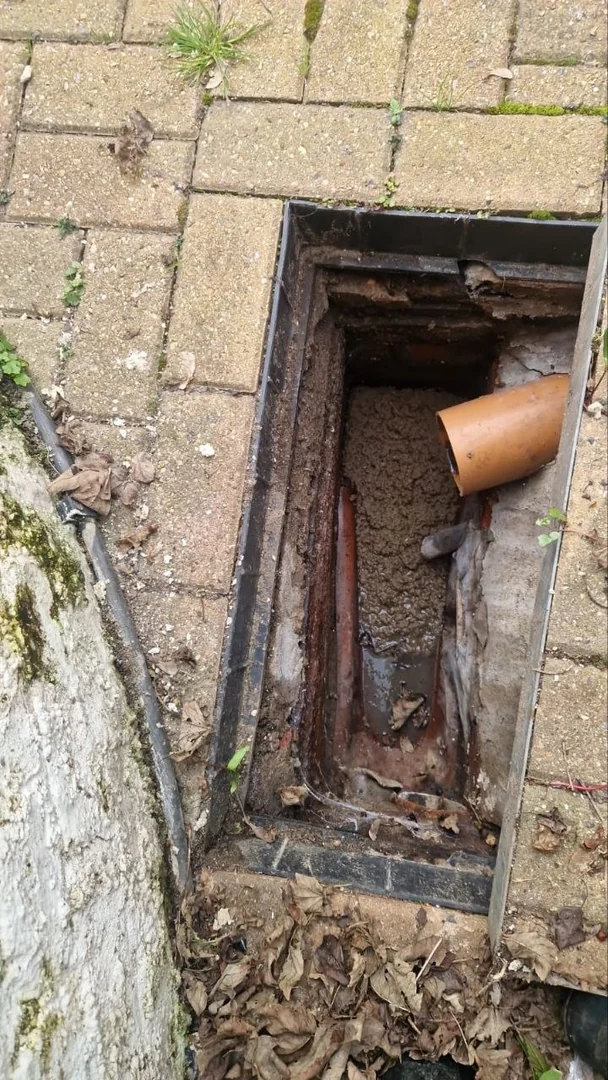 Jetting vs Rodding Drain Cleaning: Fast Fix, No Guesswork 11 Engineer inspecting a drain manhole to decide between jetting and rodding before starting work
